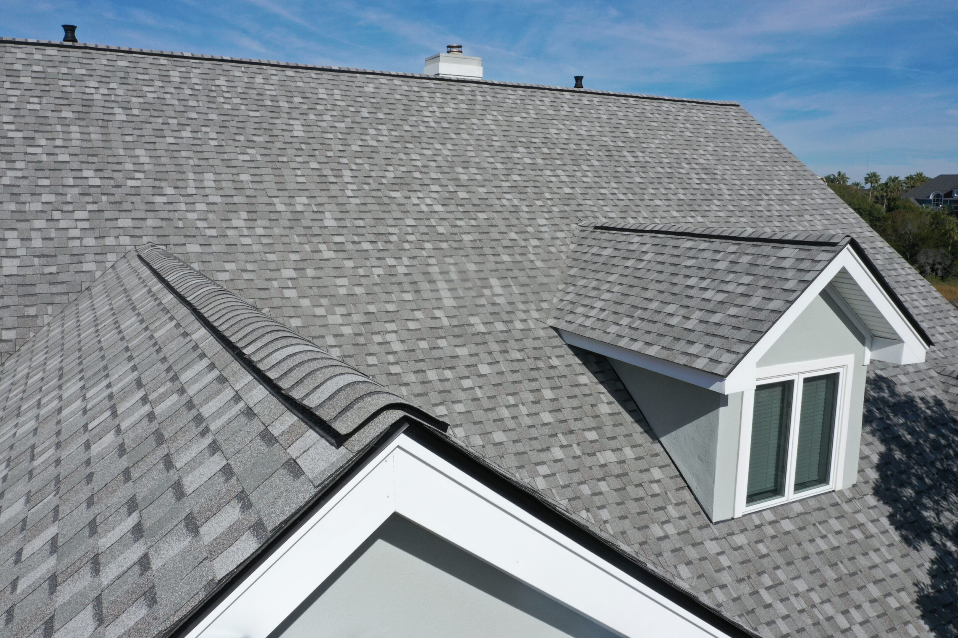 Aerial view of roof work done on a home.