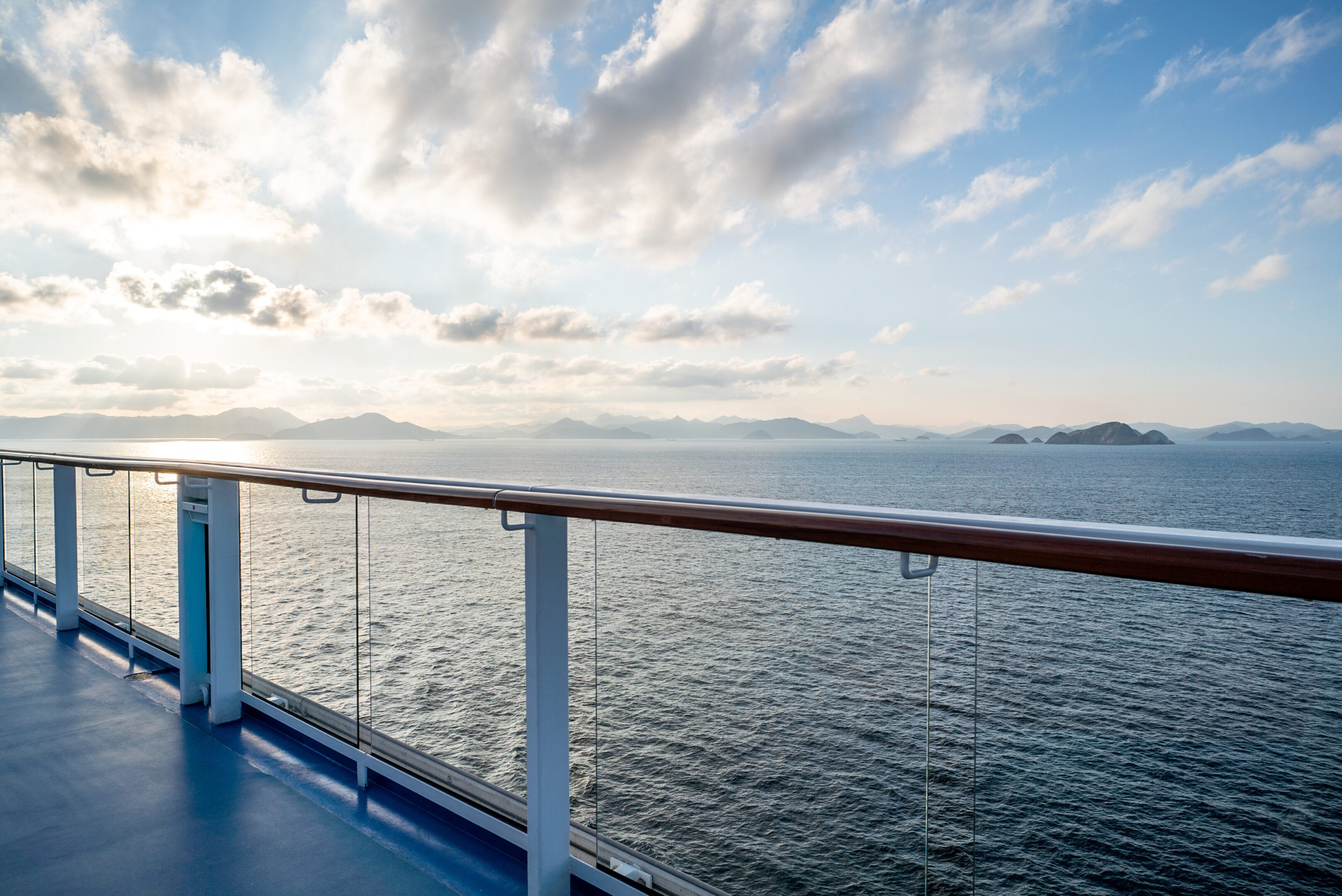 Balcony and railing of cruise ship. Seascape on background.